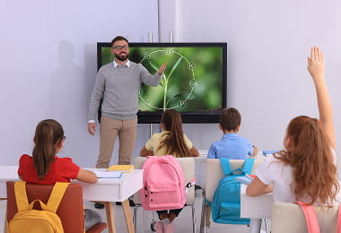 students in classroom engaging with collaborative AI-enabled learning environment